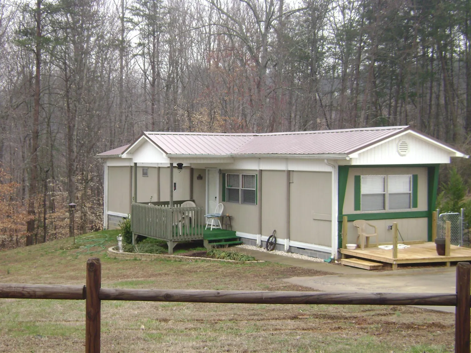 Mauve metal roof on a manufactured home with a new front deck in Elizabeth